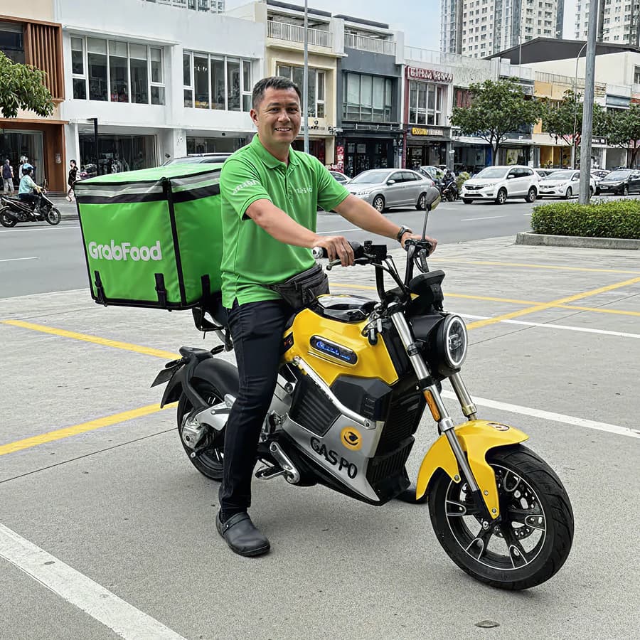 GrabFood rider on a BrightDelivery electric bike